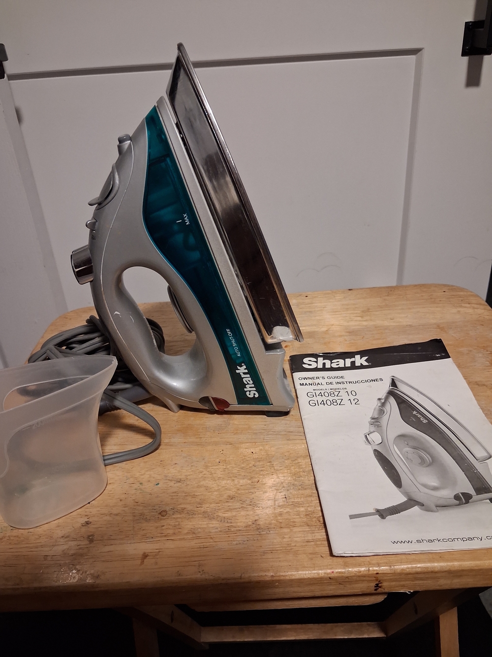 Teal and Silver Steam Iron - Reliable Garment Care